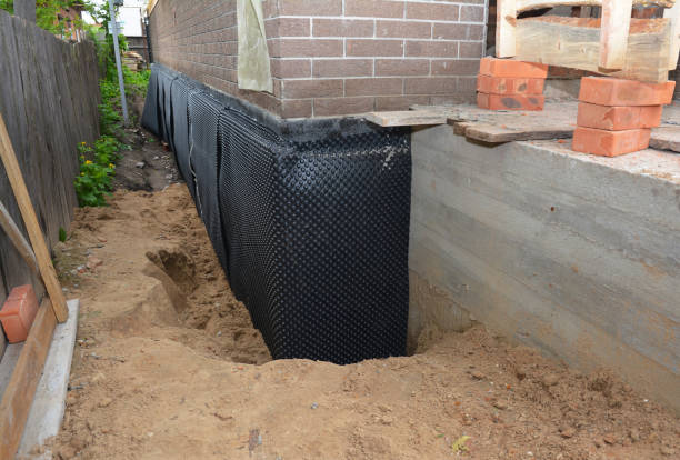 Happy homeowners after waterproofing job in New Point